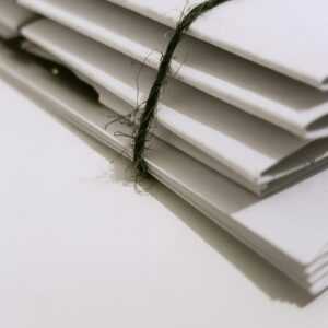 White Paper Folders With Black Tie